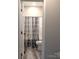 This bathroom is equipped with vinyl floors, a toilet, and a shower with a curtain at 203 S Hill Ave # 3, Albemarle, NC 28001