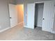 This bright bedroom includes a closet, carpet flooring, and a neutral color palette at 203 S Hill Ave # 3, Albemarle, NC 28001