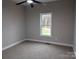 Bedroom features carpet flooring, and a window with a view at 203 S Hill Ave # 3, Albemarle, NC 28001
