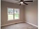 Bedroom featuring carpet flooring, and a large window with natural light at 203 S Hill Ave # 3, Albemarle, NC 28001