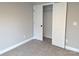This cozy bedroom includes carpet flooring, a closet, and a neutral color palette at 203 S Hill Ave # 3, Albemarle, NC 28001