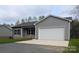 Single-Gathering home with gray siding, black shutters, and a two-car garage showcasing a well-maintained exterior at 203 S Hill Ave # 3, Albemarle, NC 28001