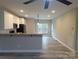 Spacious, bright kitchen with granite countertops, pendant lighting, and stainless steel appliances at 203 S Hill Ave # 3, Albemarle, NC 28001