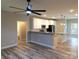 Bright, open-concept kitchen with granite countertops, stainless steel appliances, and modern lighting at 203 S Hill Ave # 3, Albemarle, NC 28001