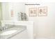 Bright bathroom featuring granite countertop vanity and decorative artwork at 214 Giant Oak Ave, Statesville, NC 28677