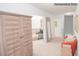 Bright hallway with natural light, an orange chair, wooden cabinet, and access to other rooms at 214 Giant Oak Ave, Statesville, NC 28677