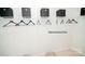 Walk-in closet with storage shelves, hanging racks, and neutral carpet at 214 Giant Oak Ave, Statesville, NC 28677