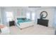 Tranquil bedroom with vaulted ceilings, stylish decor, and abundant natural light from large windows at 216 Giant Oak Ave, Statesville, NC 28677