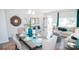 Open-concept dining area with view of living room, stylish decor, and natural light at 216 Giant Oak Ave, Statesville, NC 28677