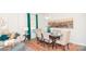 Cozy dining room complemented by modern decor, a colorful rug and a lovely painting at 216 Giant Oak Ave, Statesville, NC 28677