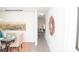 Hallway to dining room with a decorative mirror and natural light at 216 Giant Oak Ave, Statesville, NC 28677