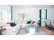 Bright living room featuring large windows, an ottoman, and comfortable seating at 216 Giant Oak Ave, Statesville, NC 28677