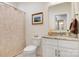Charming bathroom featuring a stylish vanity with a marble countertop and decorative shower curtain at 2802 15Th Avenue Se Pl, Hickory, NC 28602