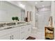 Bright bathroom featuring double sinks, granite countertops, white cabinetry, and a glass-enclosed shower at 2802 15Th Avenue Se Pl, Hickory, NC 28602