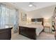 Cozy bedroom features a ceiling fan, window with blinds, and a stylish dark-stained wood furniture set at 2802 15Th Avenue Se Pl, Hickory, NC 28602