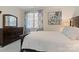 Serene bedroom with a large window, decorative curtains, and coordinating wood furniture at 2802 15Th Avenue Se Pl, Hickory, NC 28602