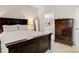 Well-lit bedroom with furniture set and an en-suite bathroom featuring double vanities and a shower at 2802 15Th Avenue Se Pl, Hickory, NC 28602