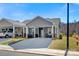 Charming gray home with a covered driveway and cozy front porch seating area at 2802 15Th Avenue Se Pl, Hickory, NC 28602