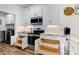 Well-lit kitchen boasts stainless appliances, white cabinetry, granite counters, and convenient pull-out shelving at 2802 15Th Avenue Se Pl, Hickory, NC 28602