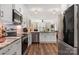 Open-concept kitchen features stainless appliances, granite countertops, and a seamless flow into the living area at 2802 15Th Avenue Se Pl, Hickory, NC 28602