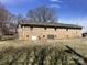 Image of the home's backyard showing its brick exterior, providing a view of the house's outdoor space at 2883 Westfield Nw Ave, Concord, NC 28027
