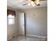 Cozy bedroom with neutral walls, tile flooring, window and closet with a door at 2883 Westfield Nw Ave, Concord, NC 28027