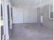 View of the covered carport featuring a concrete floor, storage area and direct access to the house at 2883 Westfield Nw Ave, Concord, NC 28027