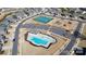Aerial view showcasing a community pool, tennis courts, playground, and ample parking at 3004 Fallondale Rd, Waxhaw, NC 28173
