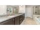 Bathroom with granite counter tops, double sinks, walk in shower and soaker tub at 3004 Fallondale Rd, Waxhaw, NC 28173