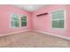 Pink bedroom with lots of natural light from multiple windows at 3004 Fallondale Rd, Waxhaw, NC 28173