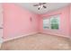 bedroom with a neutral carpet, fairie decal on the wall, and a ceiling fan at 3004 Fallondale Rd, Waxhaw, NC 28173