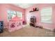 Bright pink bedroom featuring a play tent, toy shelf, and ample natural light at 3004 Fallondale Rd, Waxhaw, NC 28173