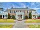The community house is a beautiful brick building with a white porch and landscaping at 3004 Fallondale Rd, Waxhaw, NC 28173