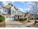 Charming two-story home featuring a craftsman-style facade, stone accents, and a two-car garage at 3004 Fallondale Rd, Waxhaw, NC 28173