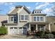 Charming two-story home featuring a craftsman-style facade, stone accents, and a two-car garage at 3004 Fallondale Rd, Waxhaw, NC 28173