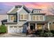 Charming two-story home featuring a craftsman-style facade, stone accents, and a two-car garage at 3004 Fallondale Rd, Waxhaw, NC 28173