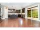 Spacious kitchen with stainless steel appliances, a kitchen island, and access to a screened porch at 3004 Fallondale Rd, Waxhaw, NC 28173