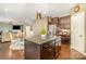 Open kitchen with island and stainless steel appliances at 3004 Fallondale Rd, Waxhaw, NC 28173