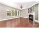 Bright living room with hardwood floors, a fireplace, and natural light at 3004 Fallondale Rd, Waxhaw, NC 28173