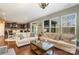 Spacious living room with hardwood floors, comfortable sofas, and open access to the kitchen at 3004 Fallondale Rd, Waxhaw, NC 28173