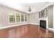 Bright living room with hardwood floors, a fireplace, and natural light at 3004 Fallondale Rd, Waxhaw, NC 28173