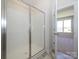 Bathroom featuring a glass shower and door leading to a bedroom at 3904 Craig Ave, Charlotte, NC 28211