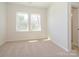 Bright bedroom features neutral carpet and natural light from double windows at 3904 Craig Ave, Charlotte, NC 28211