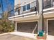 Exterior view of townhome with garage and a small porch at 3904 Craig Ave, Charlotte, NC 28211