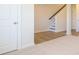 Neutral hallway featuring carpet and vinyl flooring leading to other rooms in the house at 3904 Craig Ave, Charlotte, NC 28211