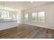 Spacious living room with hardwood floors, natural light, and an open floor plan at 3904 Craig Ave, Charlotte, NC 28211
