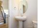 Charming powder room with pedestal sink and stylish fixtures at 3904 Craig Ave, Charlotte, NC 28211