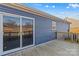 Back porch with sliding glass door and wood railing at 451 Lookout Dam Rd, Statesville, NC 28625