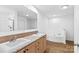 Bright bathroom with double sinks, a soaking tub, and a walk-in shower at 451 Lookout Dam Rd, Statesville, NC 28625
