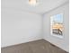 Bright bedroom with carpeted floor, neutral decor, and a window at 451 Lookout Dam Rd, Statesville, NC 28625